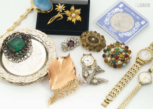 A collection of costume jewellery, including a paste set bird brooch, a simulated Edwardian target