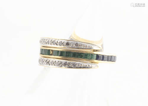 A continental emerald, sapphire and diamond night and day ring, the full gold eternity band