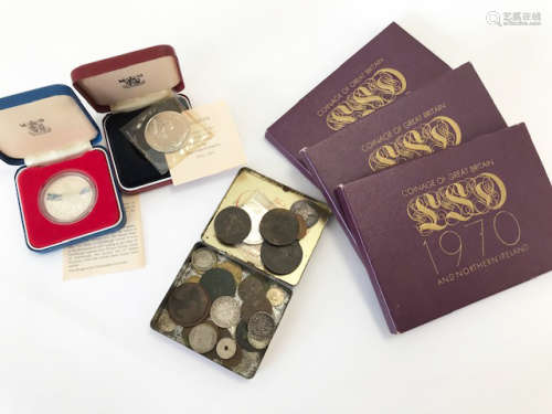 A cased Royal Mint 1977 Silver Jubilee crown, together with three 1970 Coinage of Great Britain