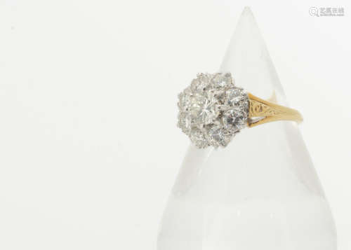 A contemporary diamond octagonal shaped cluster ring, the central brilliant cut diamond in eight