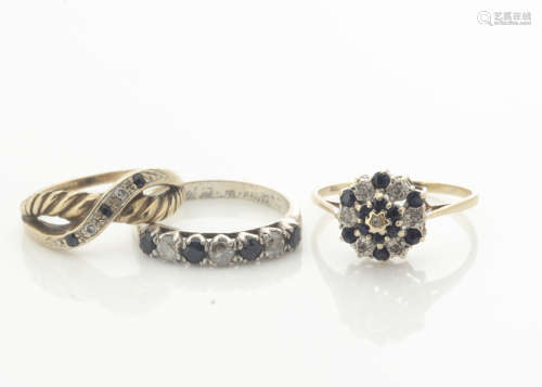 A 9ct gold sapphire and diamond cluster ring, a 9ct gold sapphire and diamond crossover ring and a
