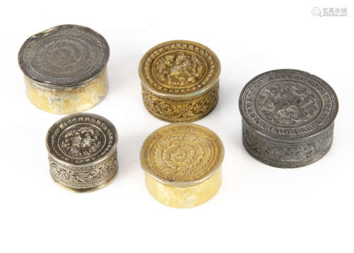 A set of three small Indian silver circular boxes, the largest 5cm diameter, dented, the other two