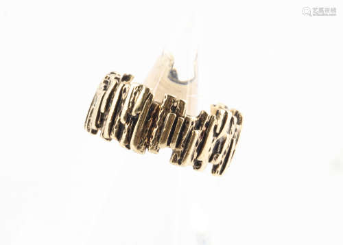 A 9ct gold textured band, the bark effect finish marked to inner shank, ring size L, 5.2g