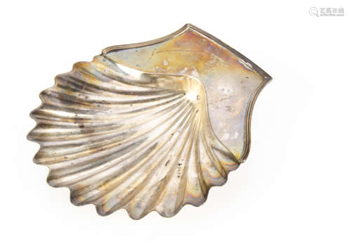 A George III silver shell dish, possibly by Hannah Northcote, bearing family crest, on three shell