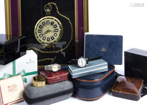 A collection of watch boxes and other items, including three watches, a pocket watch collage in