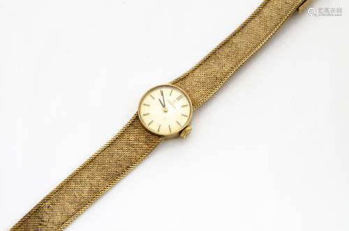 A c1960s Omega gold lady~s wristwatch, circular case on integrated mesh strap, 25g
