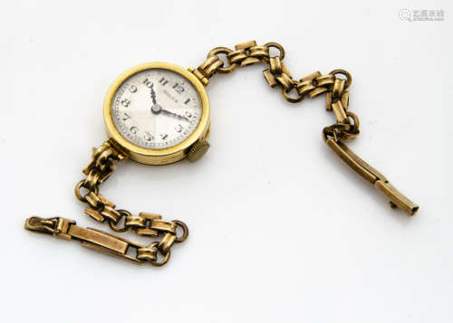 A c1930s Rolex 18ct gold cased lady~s wristwatch, 20mm circular case, appears to run, on a 9ct