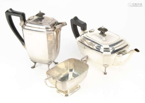 An Art Deco style three piece silver tea set by KB, comprising hot water jug, teapot and sugar