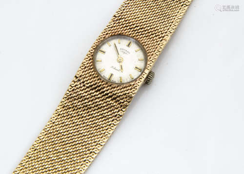 A c1970s 9ct gold Rotary lady~s wristwatch, circular dial in an integrated mesh link 9ct gold