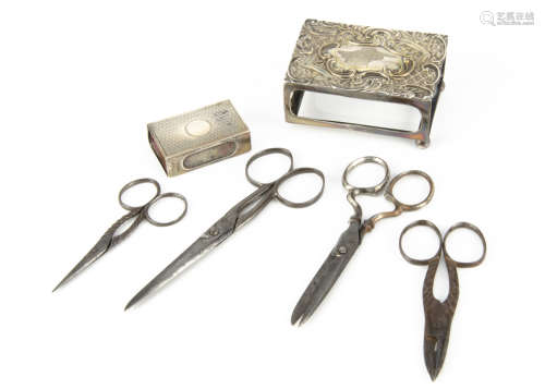 Four pairs of antique scissors, together with a silver matchbox holder, AF, and a smaller example (