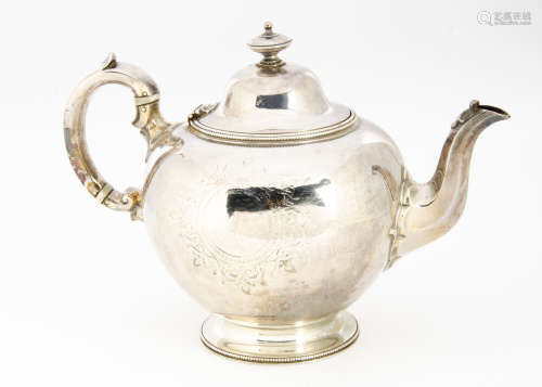 A Victorian silver teapot by Edward Barnard & John Barnard, circular on socle base, London 1861,
