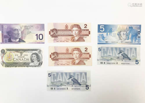 Seven Canadian bank notes, including a 1970s $1, two 1980s $2, three $5 and one £10