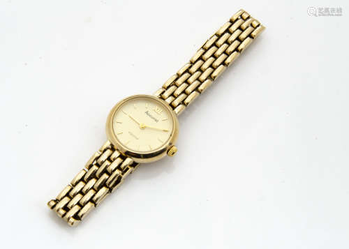 A 1990s Accurist 9ct gold lady~s wristwatch, circular case with integrated 9ct gold bracelet, 18.8g