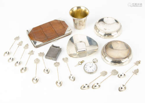 A group of collectable silver and white metal items, including a crocodile skin and silver purse,