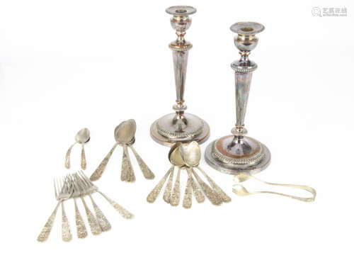 A pair of late Georgian or early Victorian Sheffield plate candlesticks, together with a part