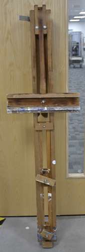 A mid Century artist's easel, with aluminum fittings, having some repair on a tripod support, length