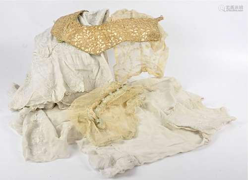 A selection of Victorian and early 20th Century clothing, including a petticoat, skirts, a bonnet,