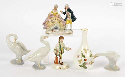Three Lladro figures of swans, together with a Wedgwood vase in the 'Wild Strawberry' pattern, a