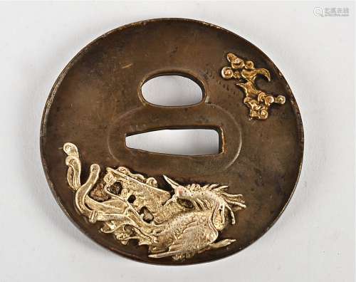 A late 19th/early 20th Century Japanese tsuba, with applied metalwork decoration, taking the form of