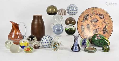 A small group of 20th Century glass paperweights, including an angel fish, a stone charger also