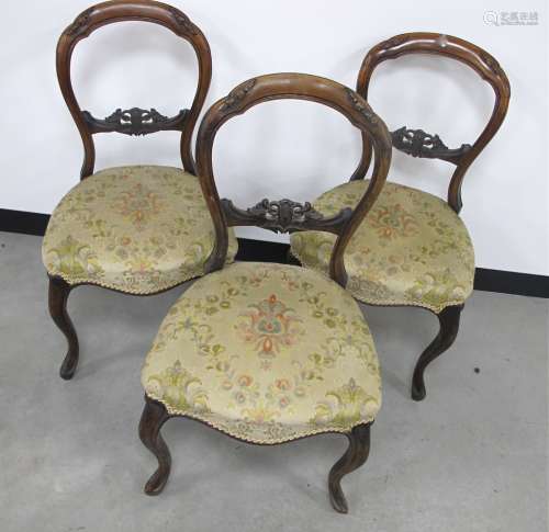 Three 19th Century walnut balloon back dining chairs, with carved top and centre rails,