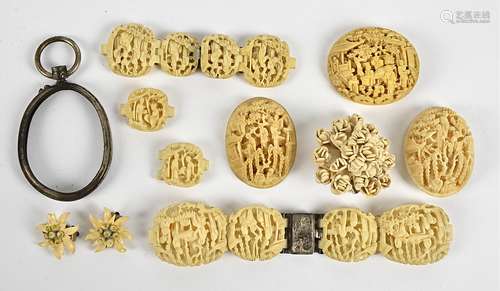 A 19th Century Chinese ivory carved bracelet, AF, the oval links carved with figures within willow