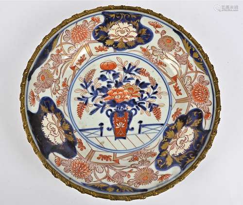 A 19th Century Chinese Imari gilt metal mounted charger, decorated with central vase of flowers