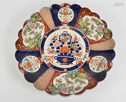 A large Meji period Japanese scolloped shaped dish, with central vase of flowers, with fan design