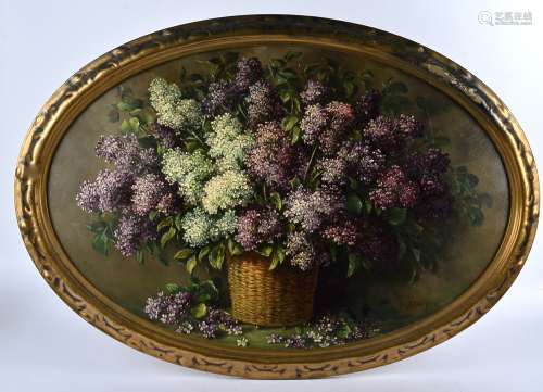 A late 19th/early 20th Century oil on canvas, still life of lilacs in a basket, signed (lower right)