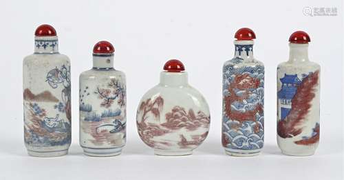 Five underglaze red and blue Chinese snuff bottles, four of cylindrical form, decorated with various