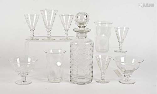 A Webb Corbett glass licquor set, comprising a cylindrical decanter, four glasses and another larger