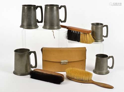 Nine English pewter mugs, assorted sizes, together with five wooden-backed shoe brushes, two