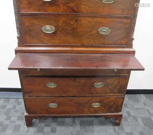 A mahogany George III chest on chest, top section with two short and three long graduated drawers,