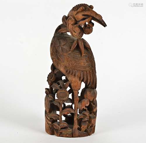 A 19th Century Chinese bamboo carving of a waterbird amongst flowers, height 33cm