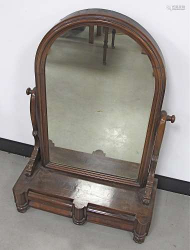 A William IV mahogany dressing table mirror, the arched swing mirror above a two drawer base, raised