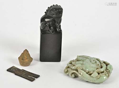 A small group of Chinese carved stone objet d'art, to include a mythical beast on plinth, height