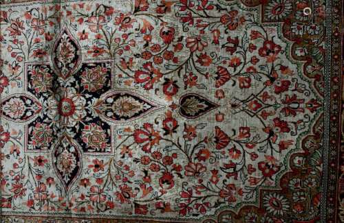 A Middle Eastern wool work runner, with floral and geometric motifs upon a pink ground, tassels to