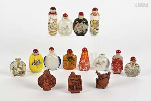 A quantity of Chinese snuff bottles, to include cinnabar lacquer examples, cameo glass, a wooden