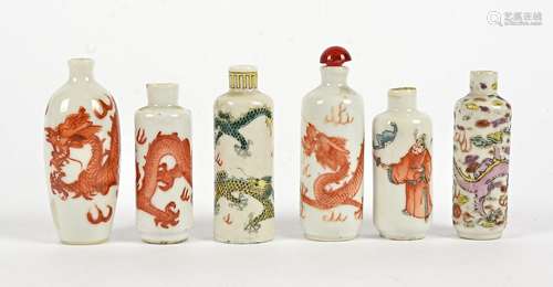 A small quantity of Chinese snuff bottles, in polychrome enamels, predominantly with dragons chasing