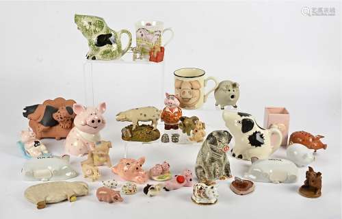 A large collection of pig figurines and ephemera, in glass, pottery, ceramic, resin and metal and