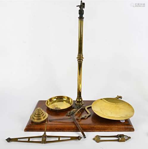 A set of brass scales, on a wooden base, height 64cm