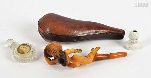 A Belle Epoque carved Meerschaum pipe, in the form of a curvaceous nude with floral bonnet, cased,