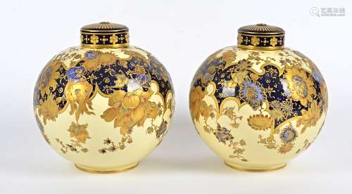 A pair of 19th Century Royal Crown Derby lidded vases, ovoid form, gilt floral decoration on a