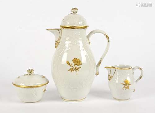 An early 20th Century Meissen three piece coffee set, with gilt floral decoration on a white ground,