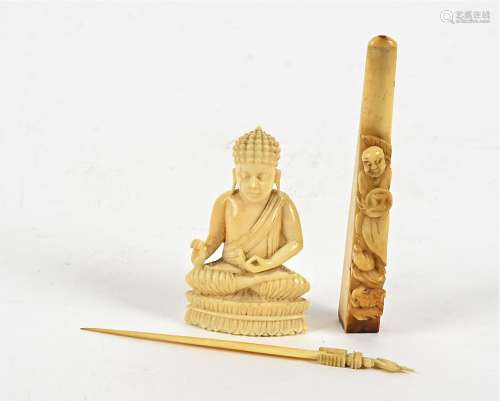 A late 19th or early 20th Century ivory figure of a Buddha, 5.5cm, together with a 1920s cheroot