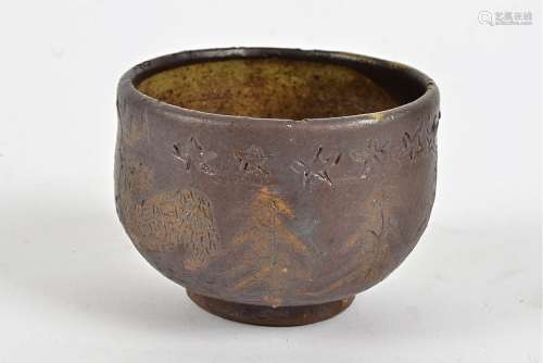 A Scandinavian contemporary studio pottery bowl, in the folk art tradition, with evergreen trees,
