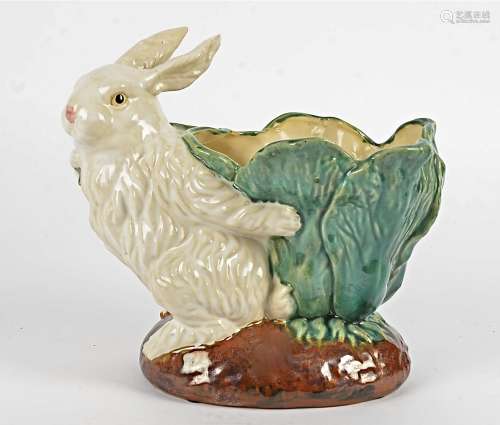 A large pottery jardiniere taking the form of a rabbit holding a cabbage, probably Continental,