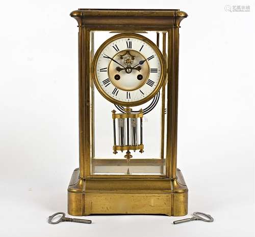 A late 19th Century French brass mantel clock, the 11.5cm white enamel dial with Roman numerals (