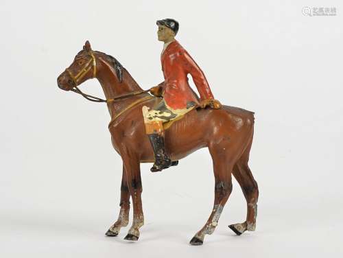 A spelter figure of a huntsman, mounted on his horse, the tail a/f, height 10cm