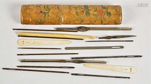 A 19th Century oval straw needle case, with foliate decoration, height 12cm